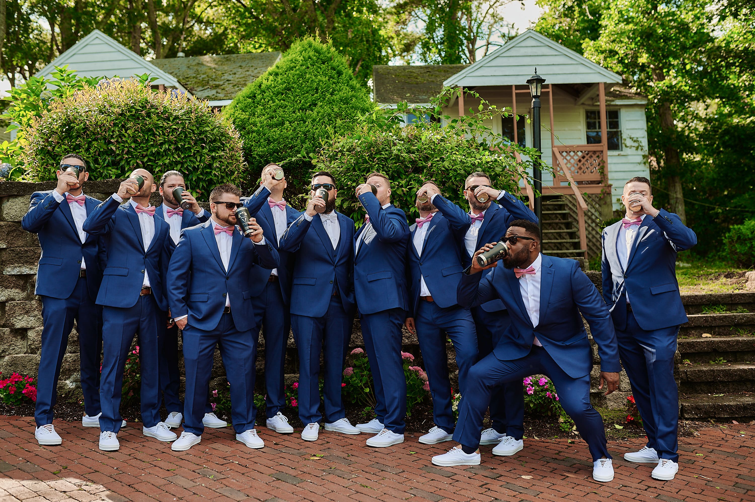 Fun wedding party group photo of groomsmen in blue suits